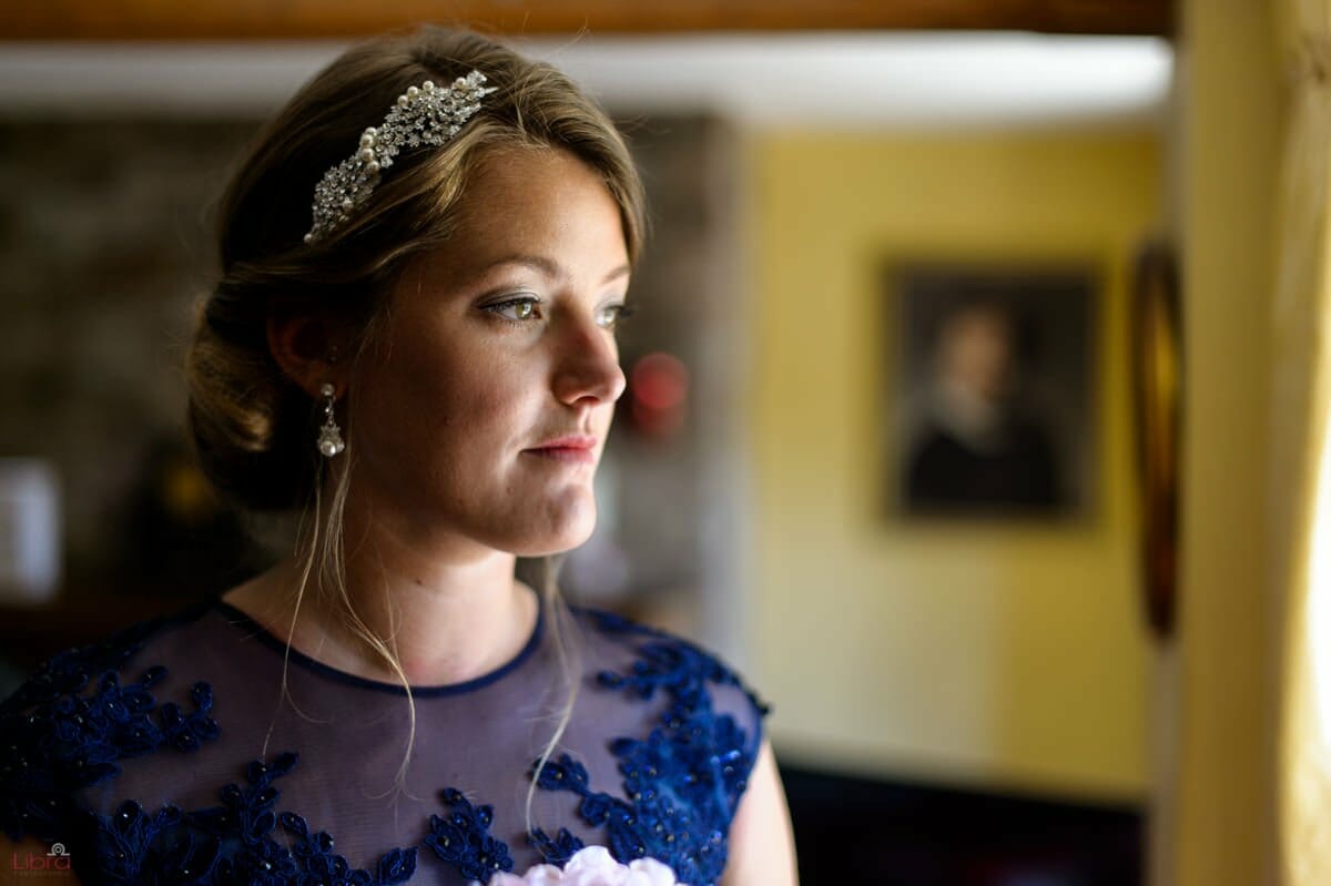 bridesmaid looks out of window