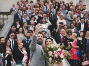 Bride and groom take selfie at Lulworth castle wedding
