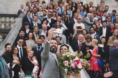 Bride and groom take selfie at Lulworth castle wedding