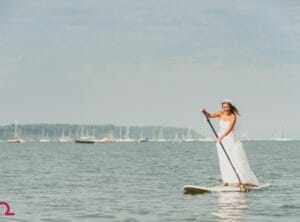 Bride paddle boards in Poole