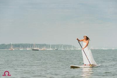 Bride paddle boards in Poole