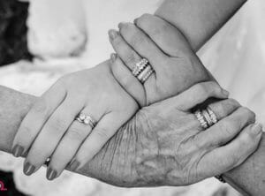Three generations holding hands