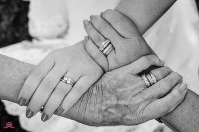 Three generations holding hands