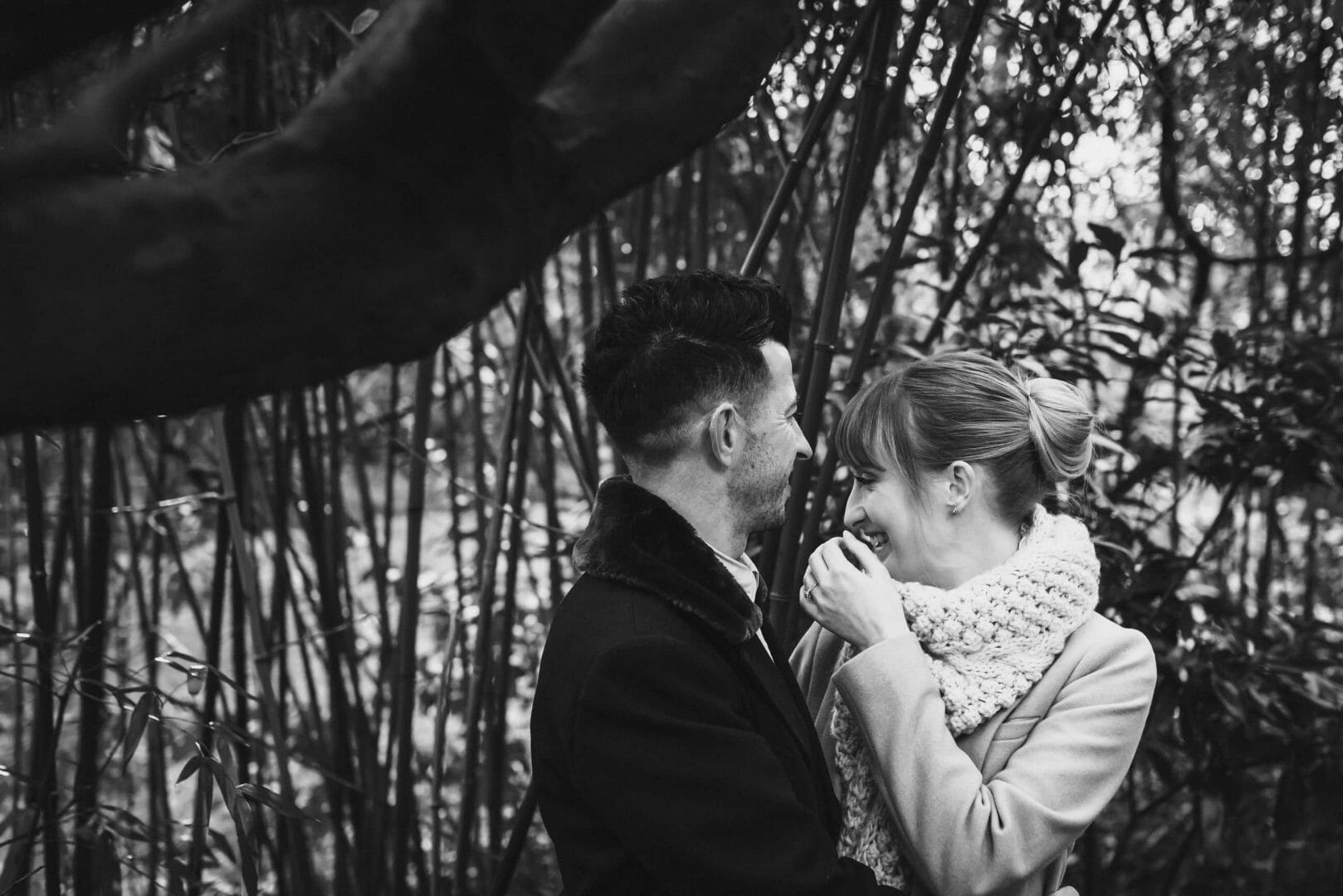 Groom makes bride laugh in the bamboo - Bournemouth gardens