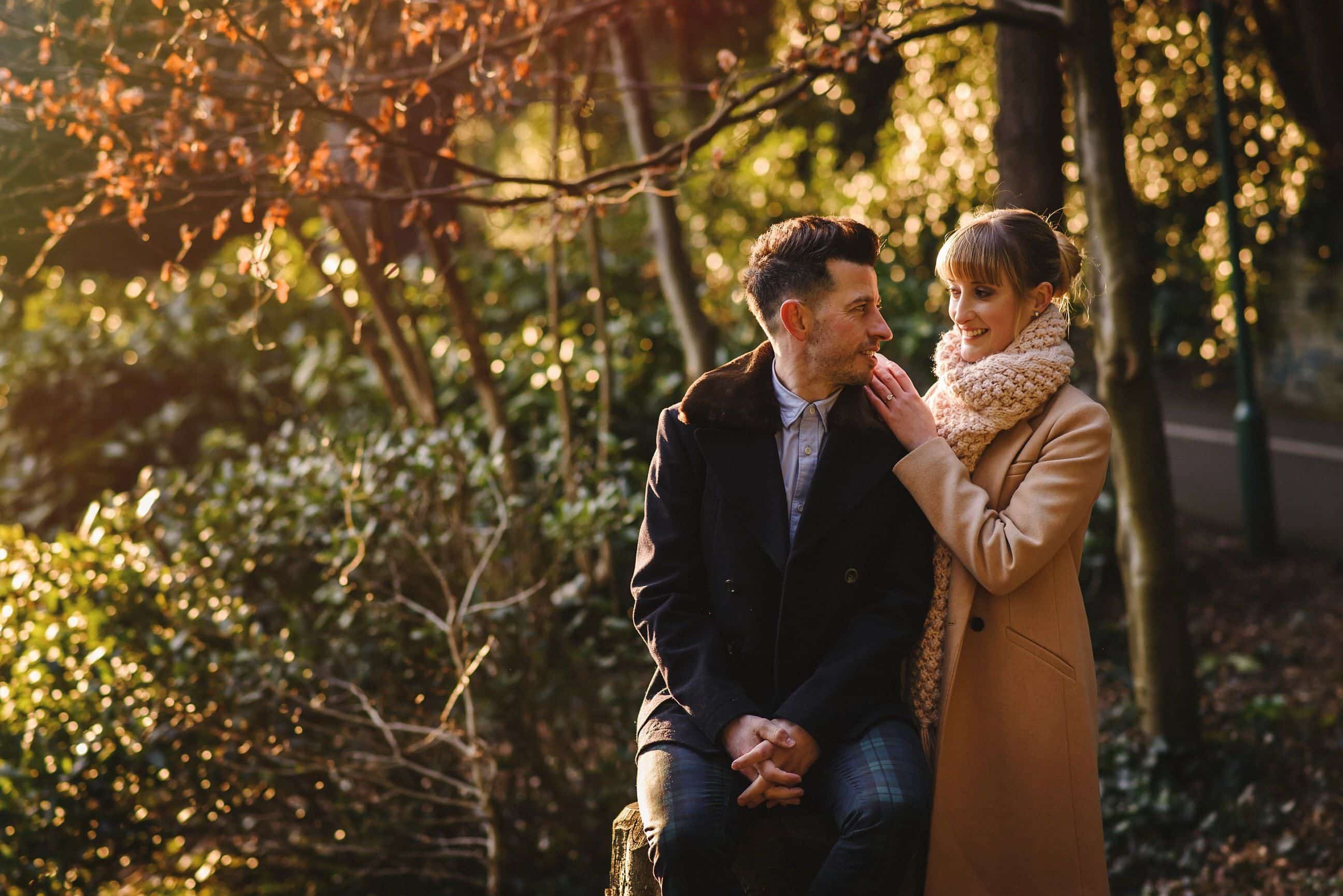 Couple stand in the evening light