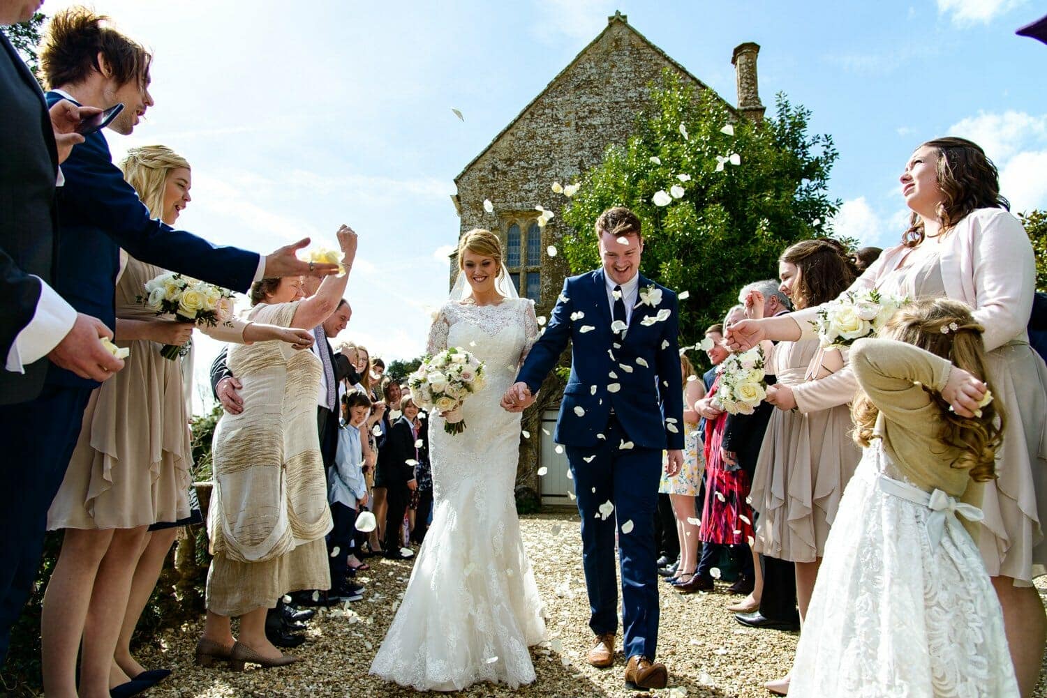 Throwing petals Brympton House wedding