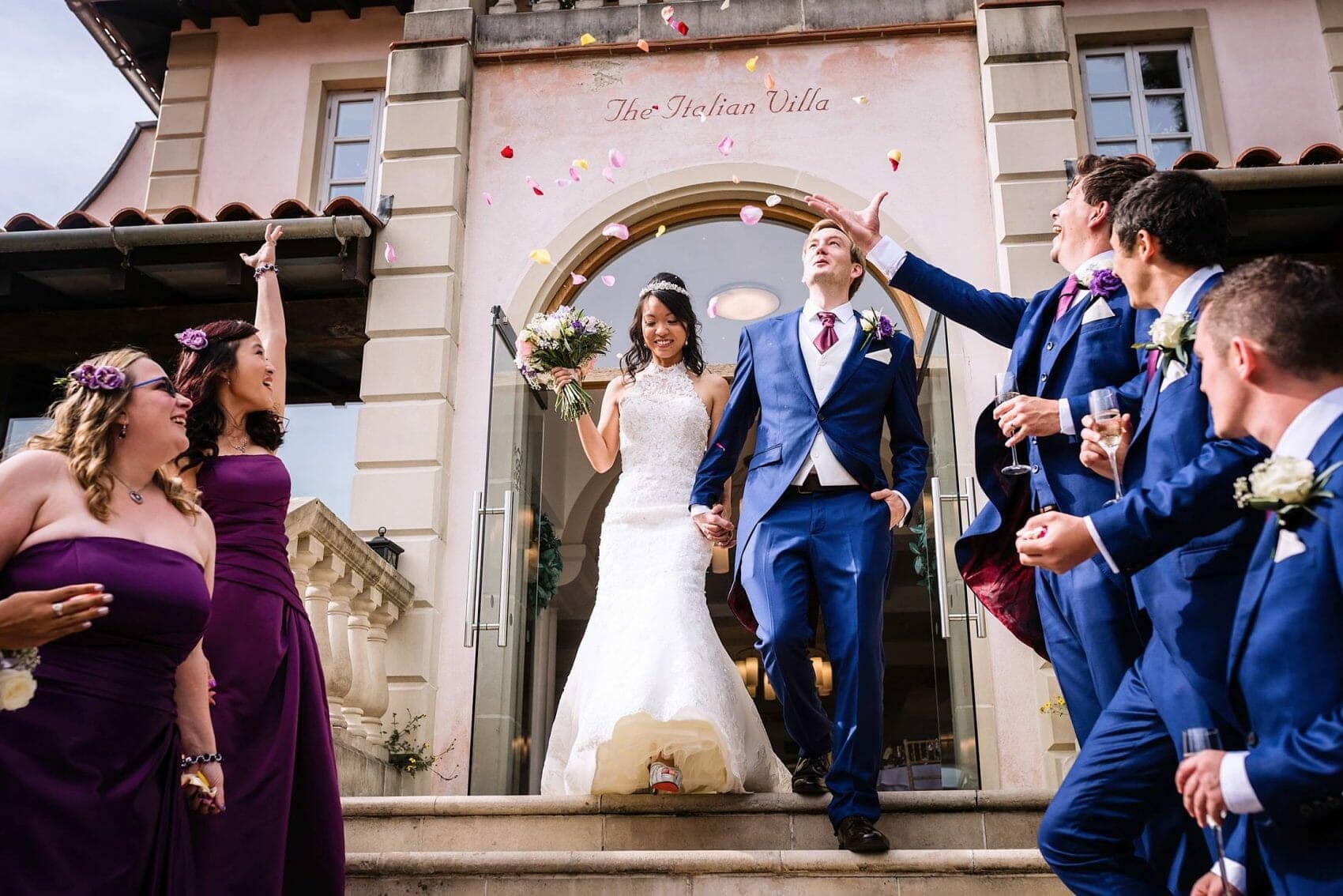 Bride and Groom exit through confetti at the Italian Villa
