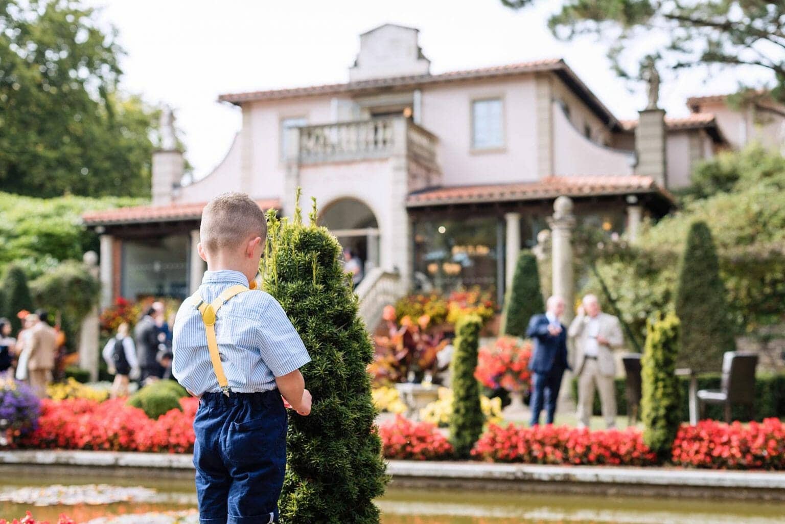 Boy hides at the Italian Villa