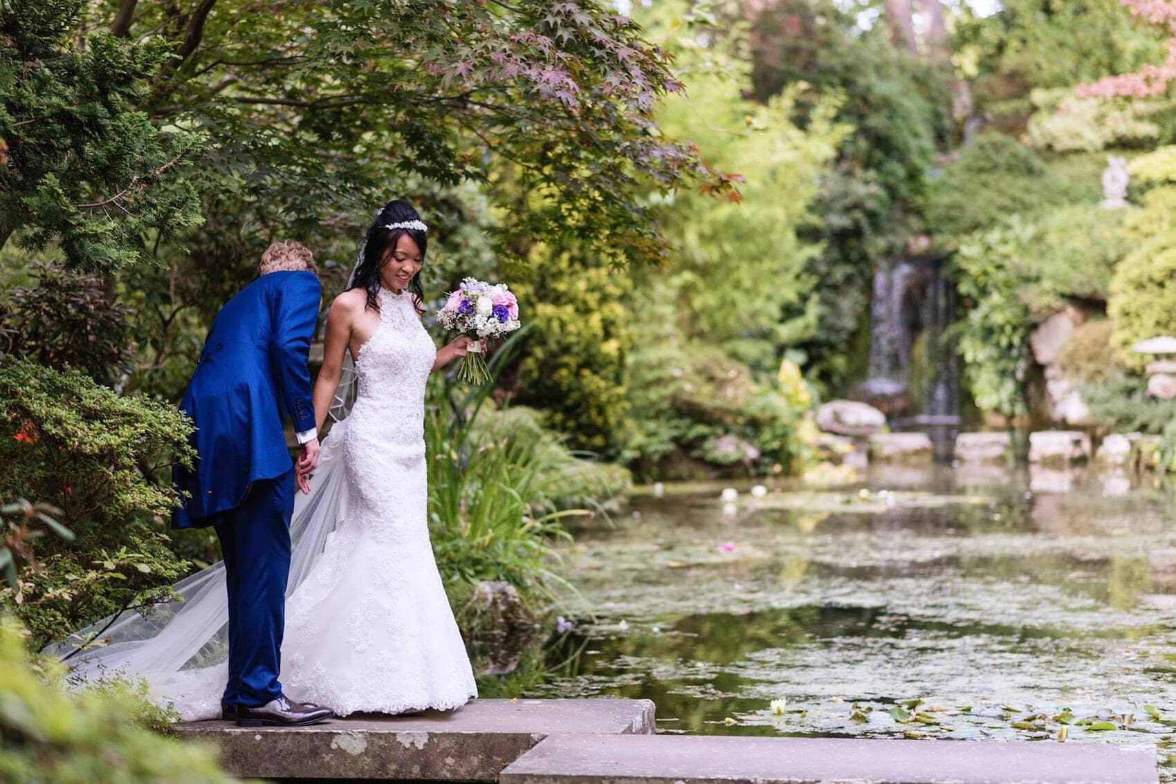 Bride and Groom Crossing the pond at The Italian Villa