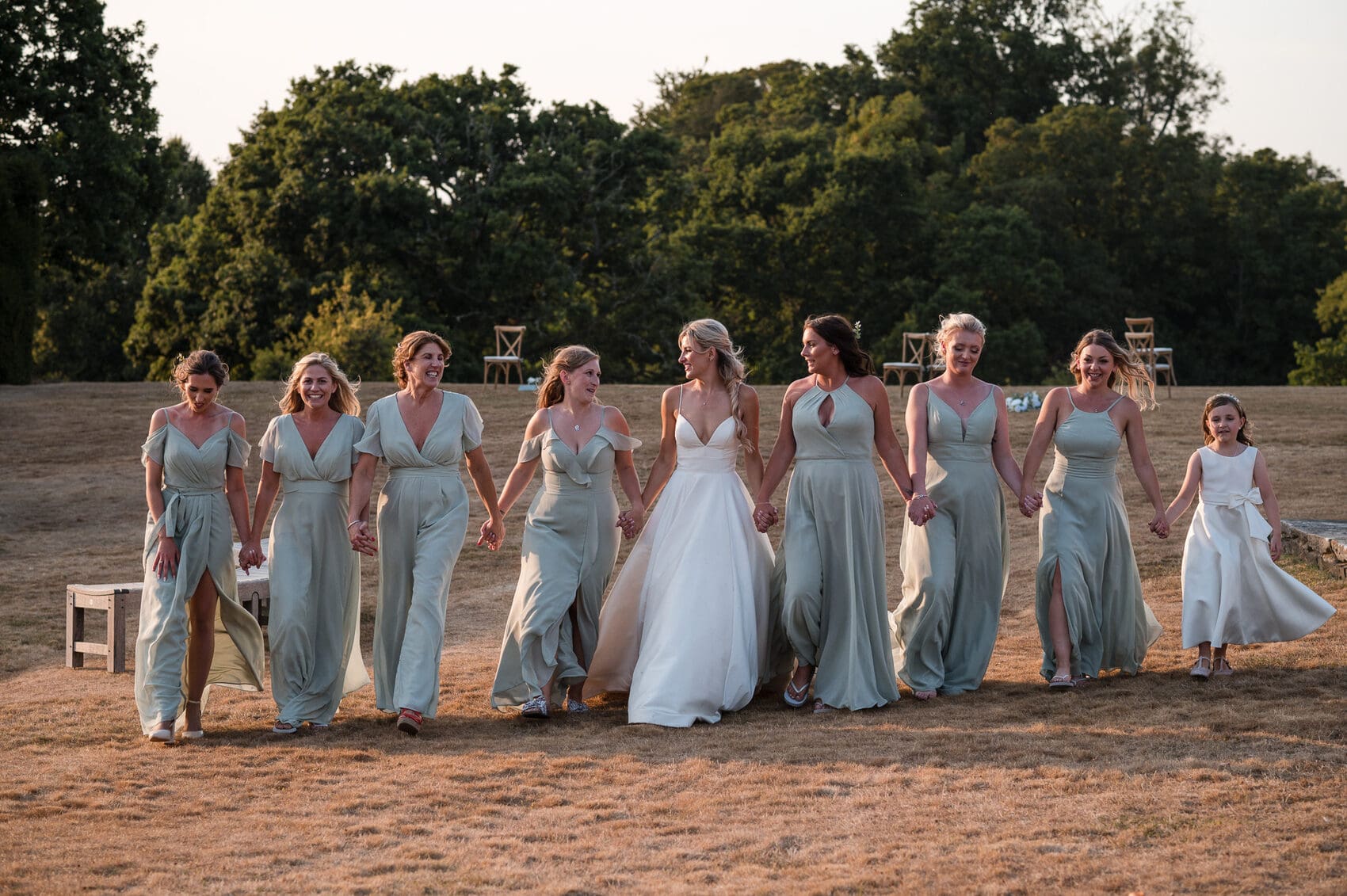 Bridesmaids walking on Lawn at Hale Park House Wedding