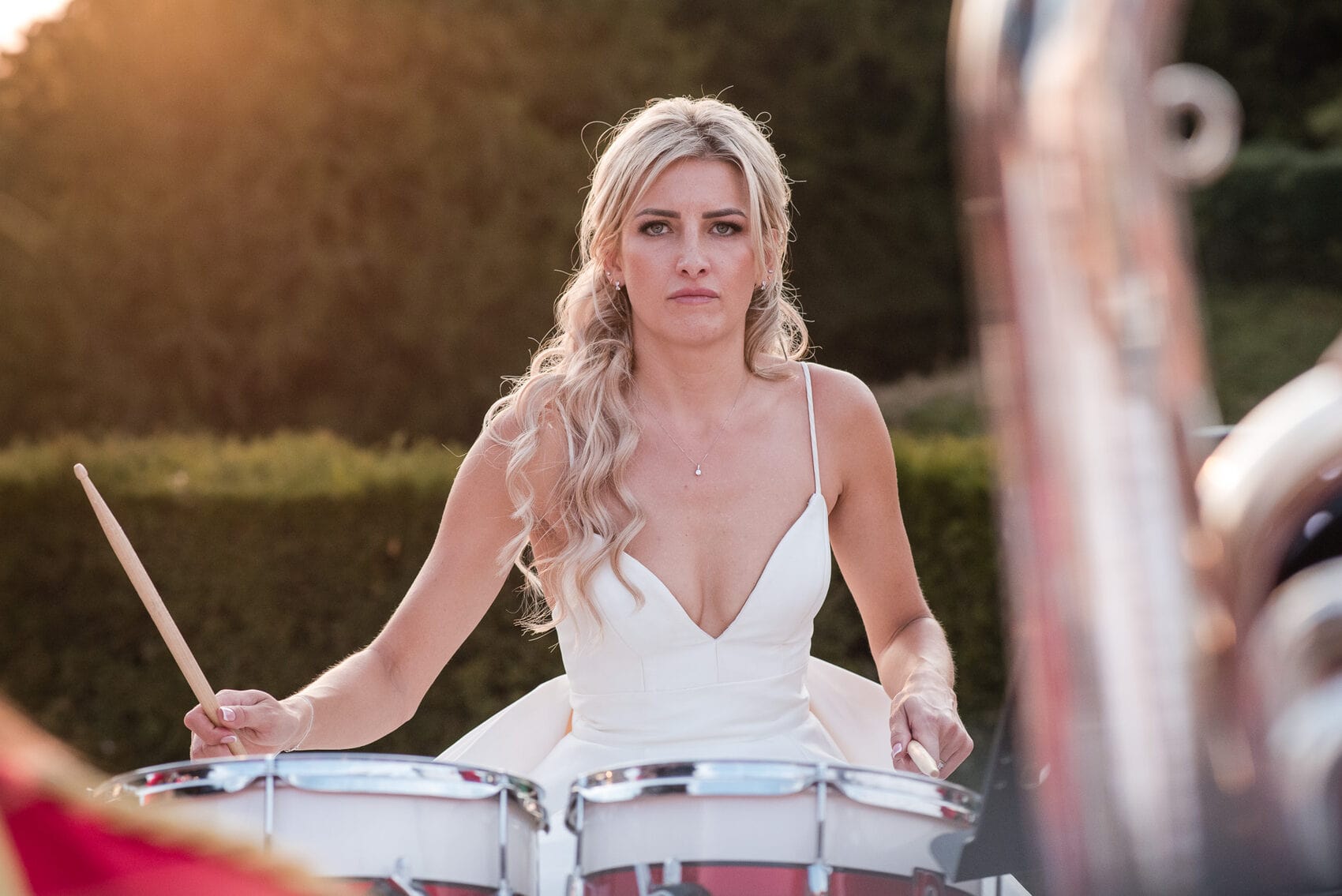 Bride playing the drums at Hale park House