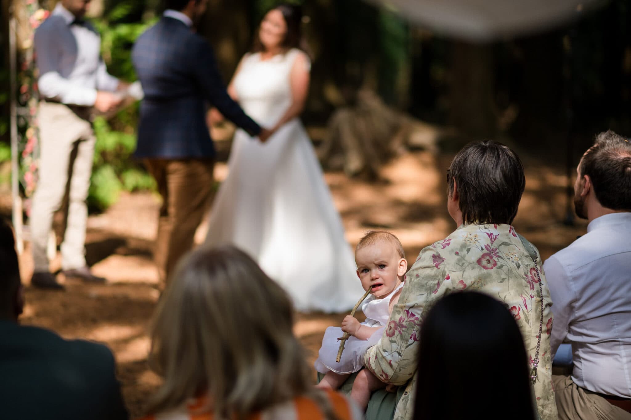 flowergirl eats stick at Weddings in the Wood