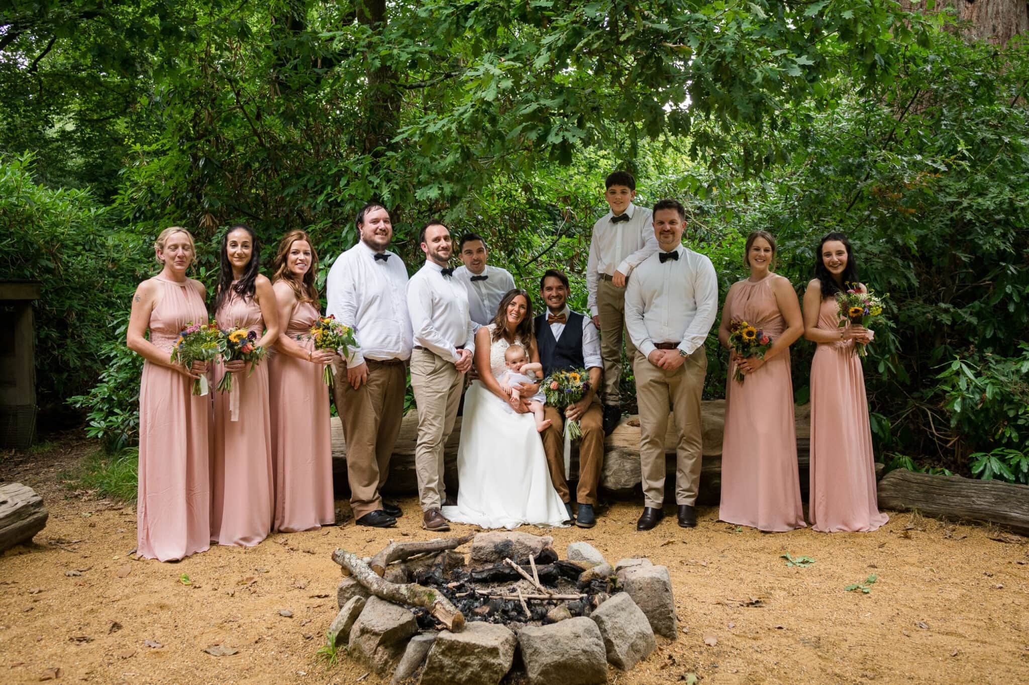Relaxed bridal group photo in the woodland