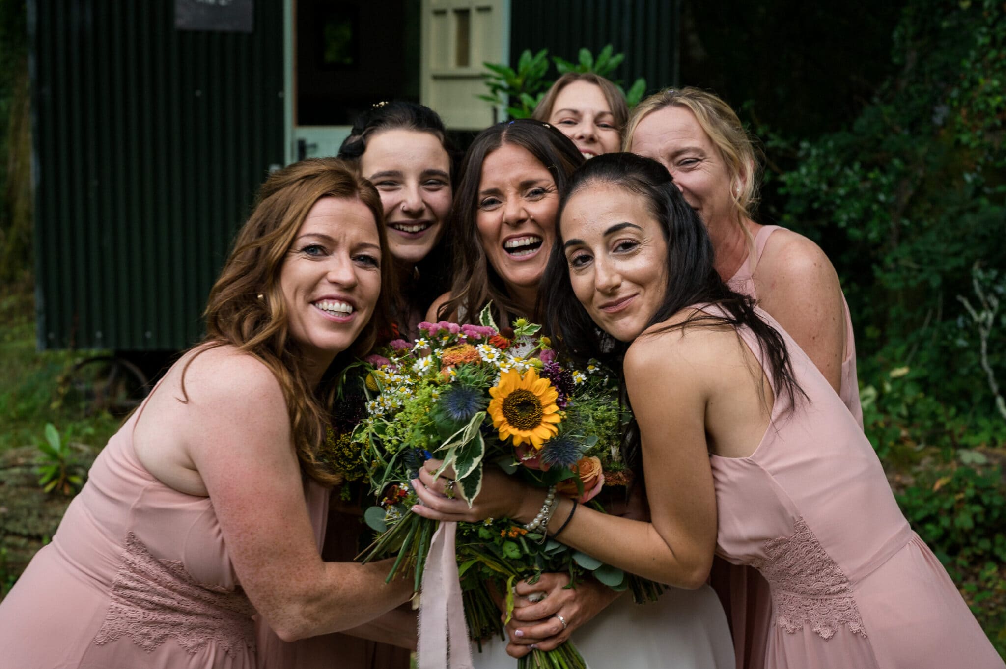 Girls hug together at Weddings in the Wood in the New Forest
