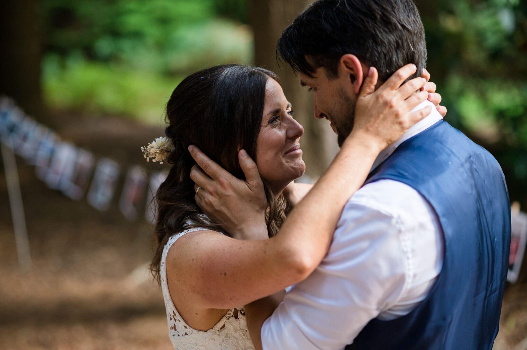 Bride and groom share a private moment in the New Forest