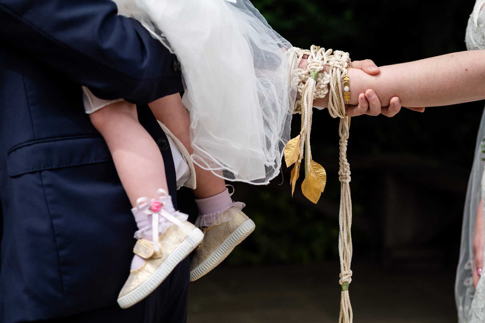 Groom comforting his child during Hand Fasting ceremony | Documentary Wedding Photography