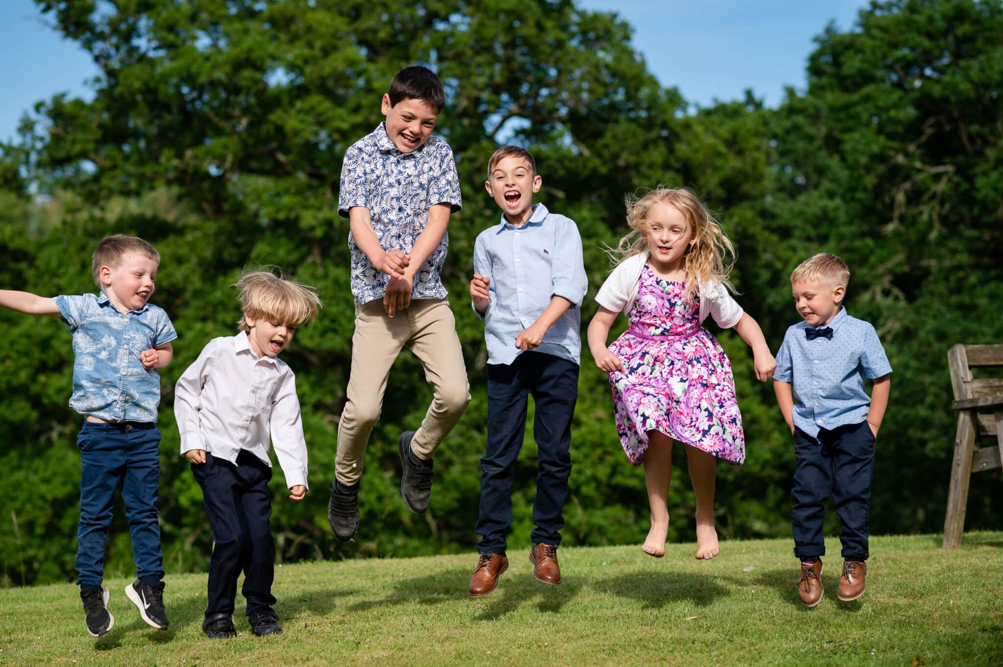 Wedding children jumping at Ashley Wood Farm wedding