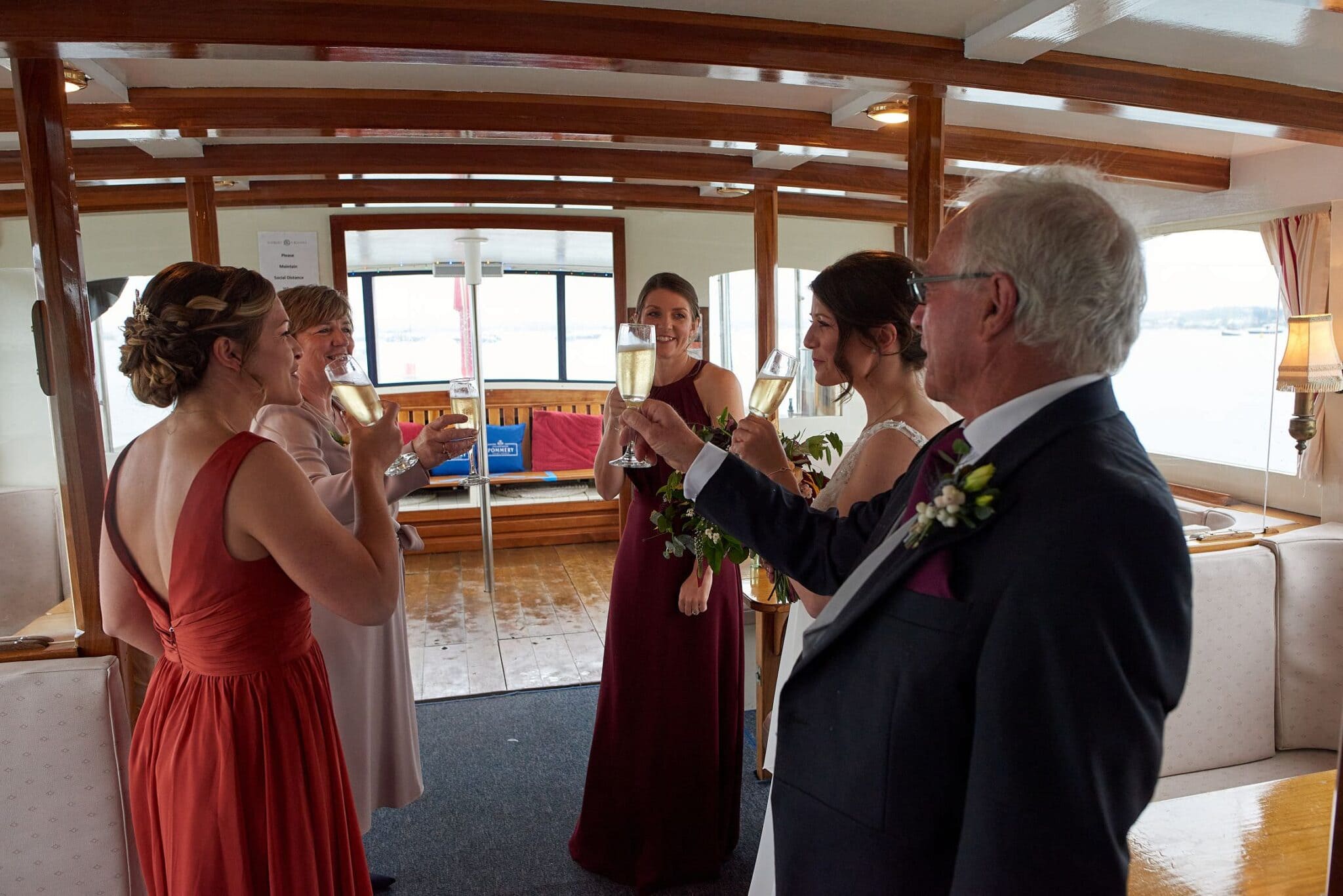 Bride and Bridesmaids celebrate on. the Dorset Queen