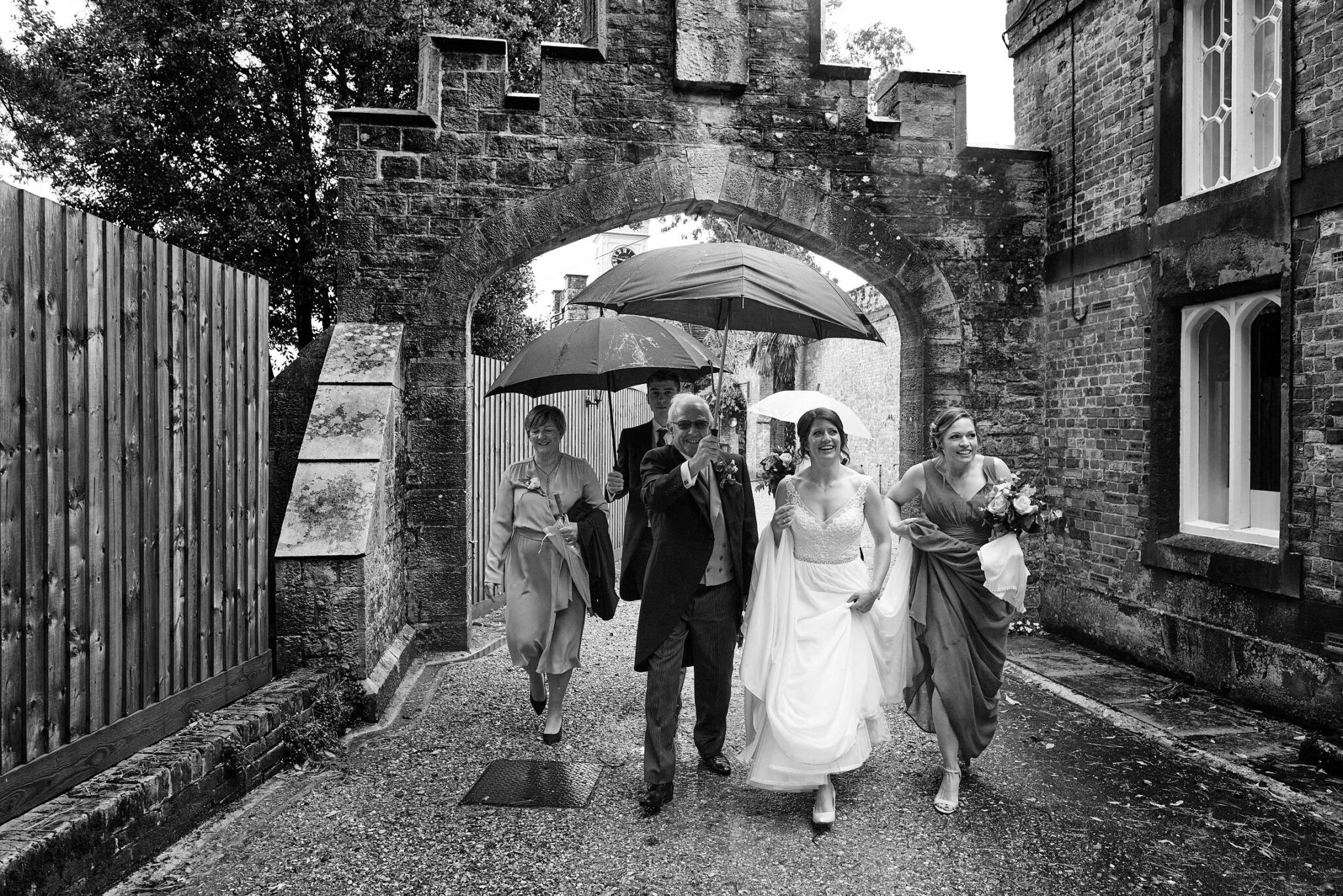Walking in the rain at Brownsea Island wedding