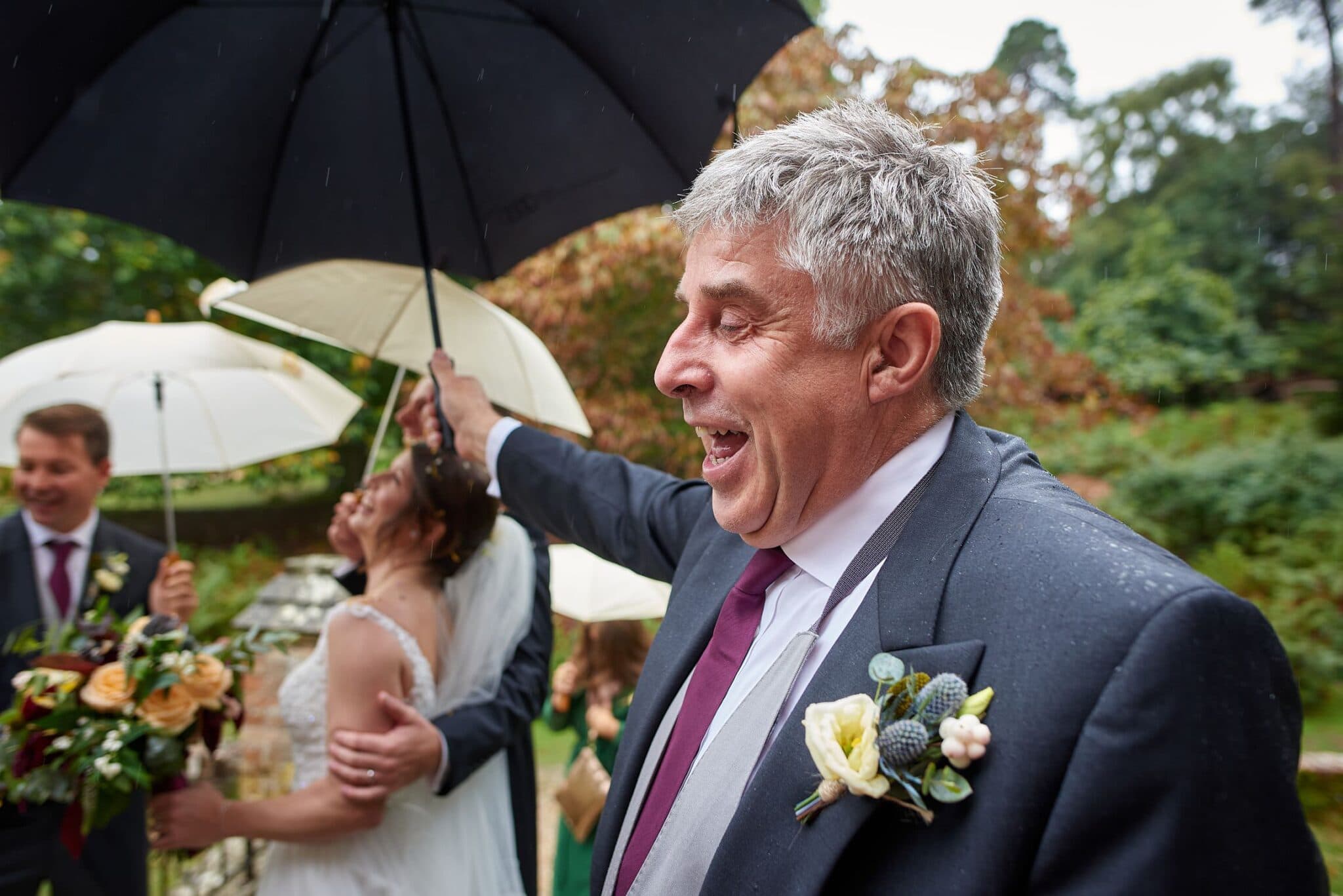 Father of the groom in the rain