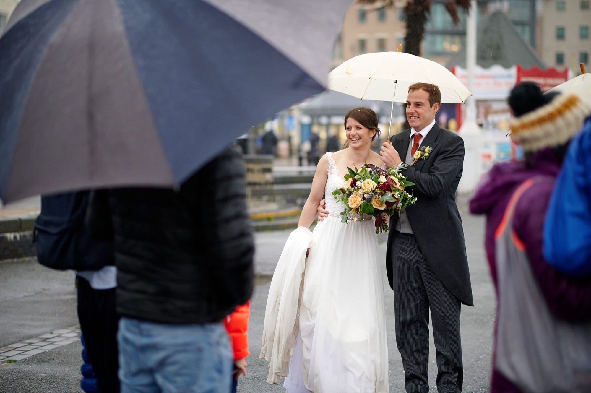 Bride and Groom at Poole quay in the rain