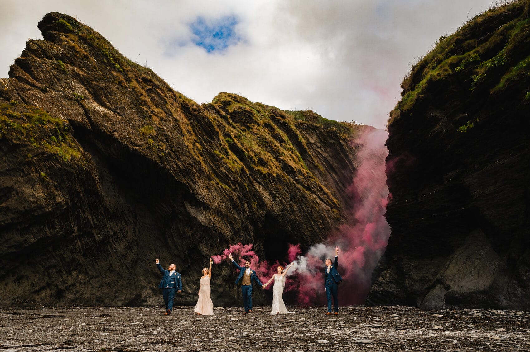 pink smoke bomb at Tunnels Beaches Wedding