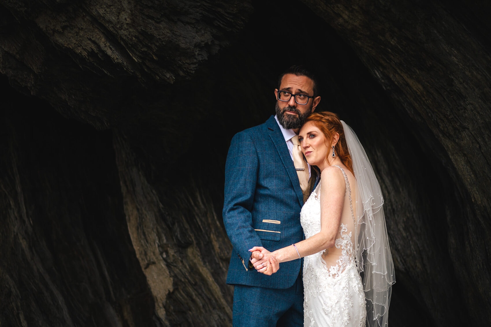 Bride and groom portrait in the cliff at Tunnels Beaches Wedding venue