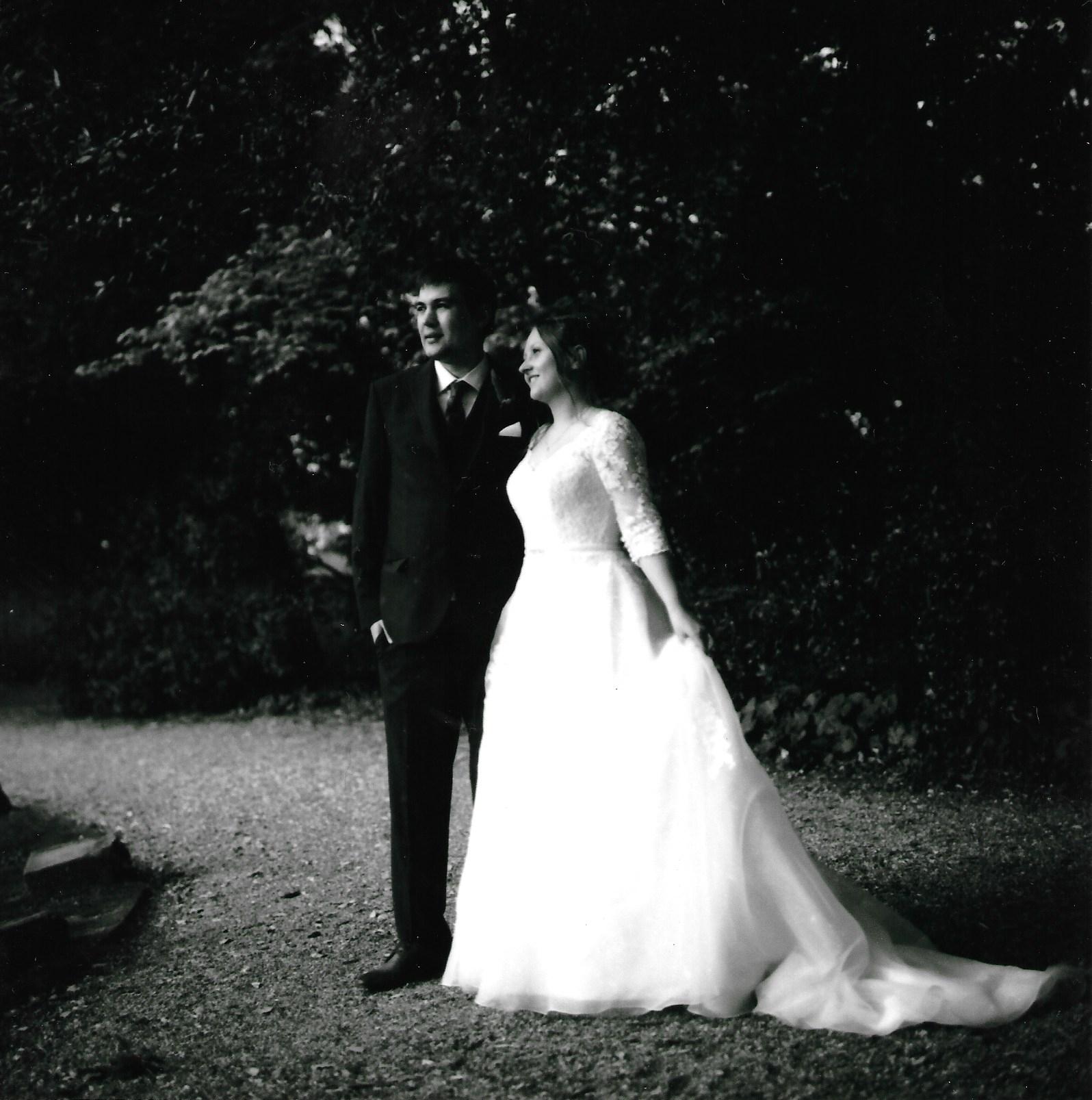 Bride and Groom shot of medium format film camera at Highcliffe castle wedding