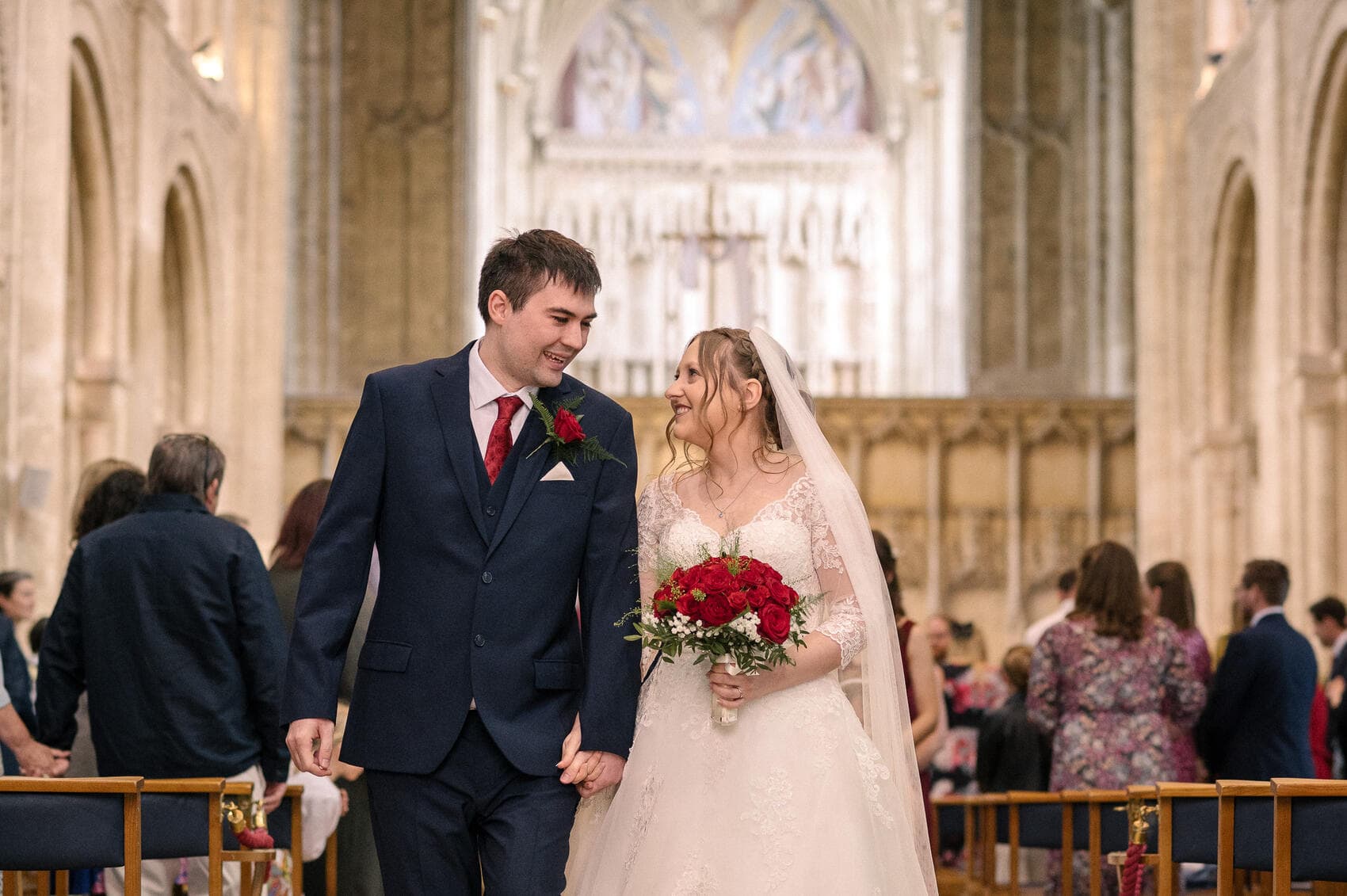 a loving look between the couple at Christchurch Priory wedding ceremony