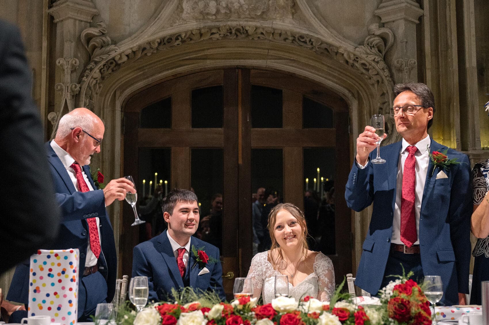 The fathers toast the happy couple at Highcliffe castle wedding
