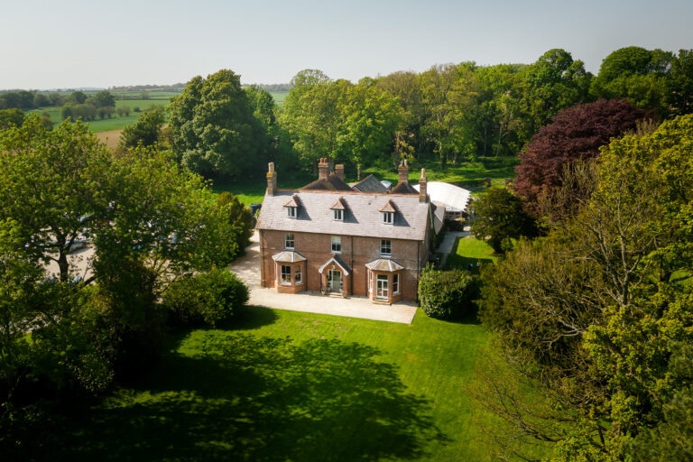 The front lawn and vieew of Abbots court from the air