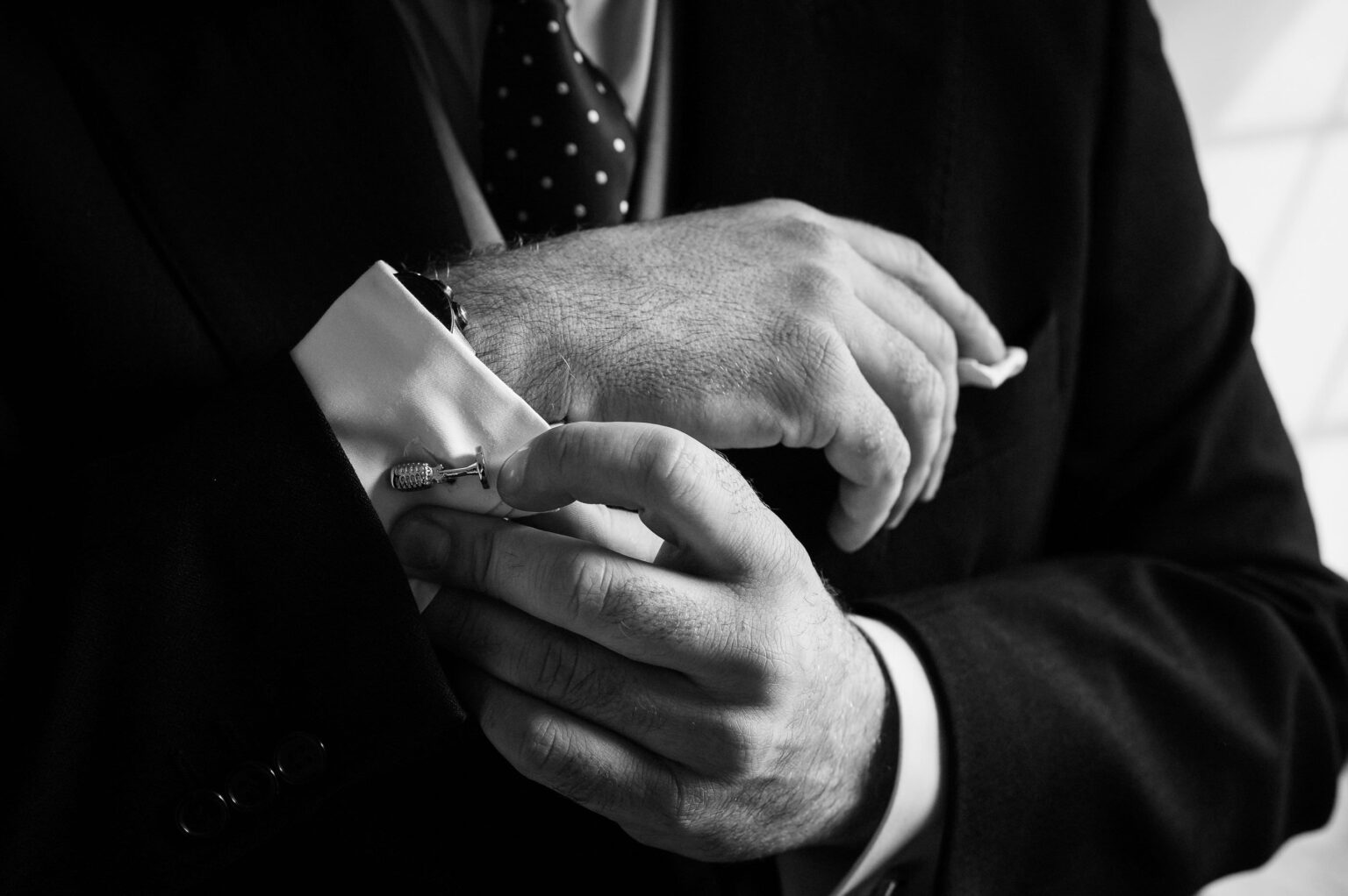 The grooms cufflinks in black and white