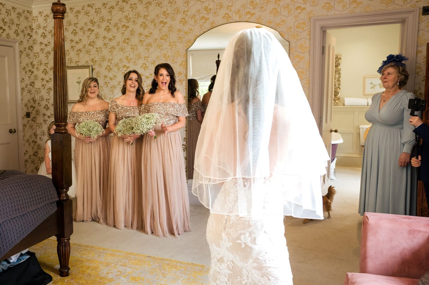 Bridesmaids see the dress on for the first time