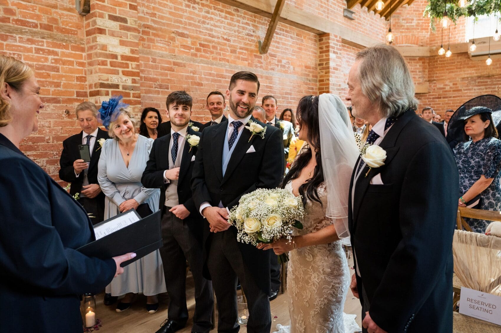 groom greets bride at Abbots Court wedding barn