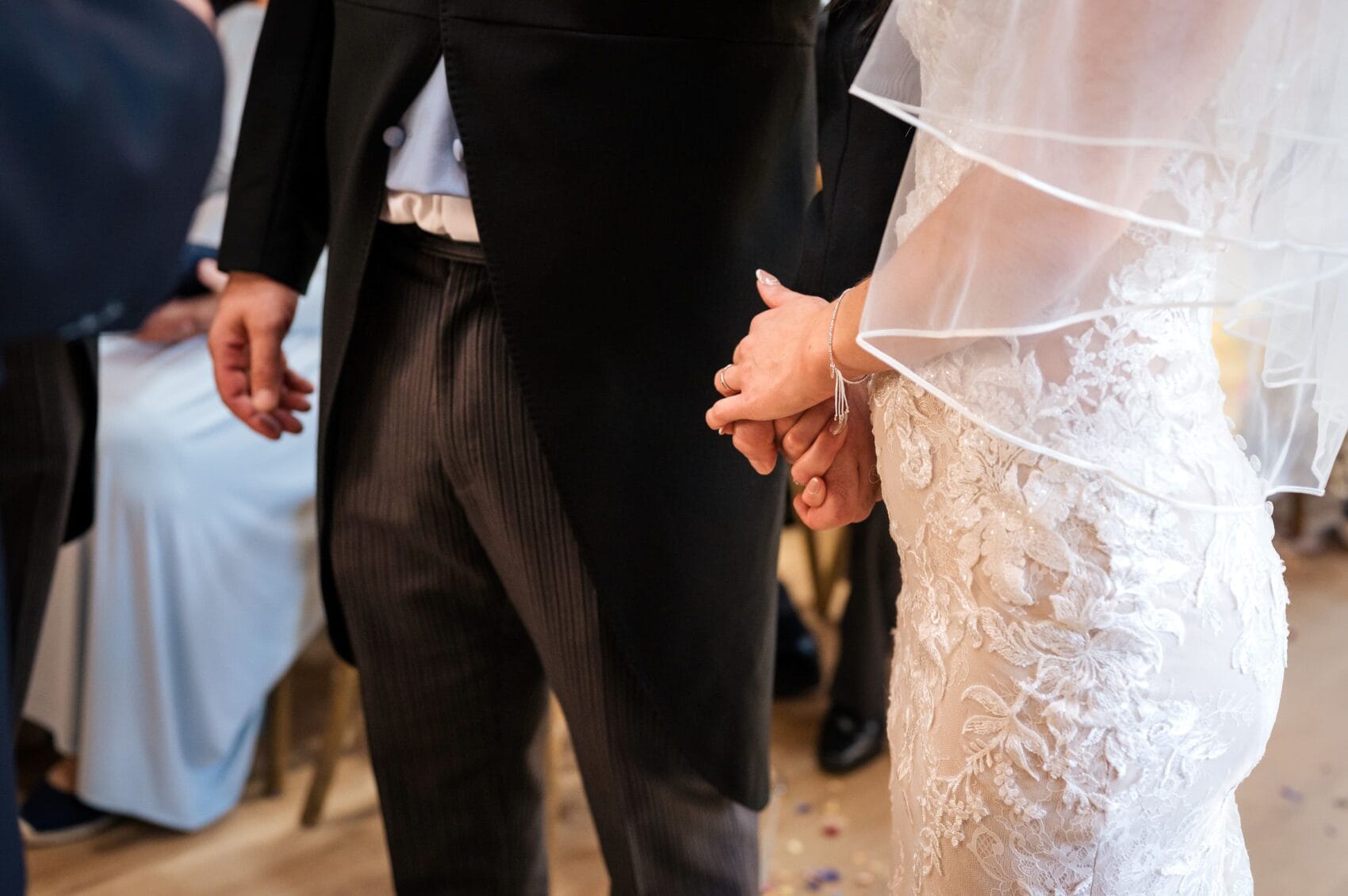 Couple holding hands at Abbots Court wedding barn