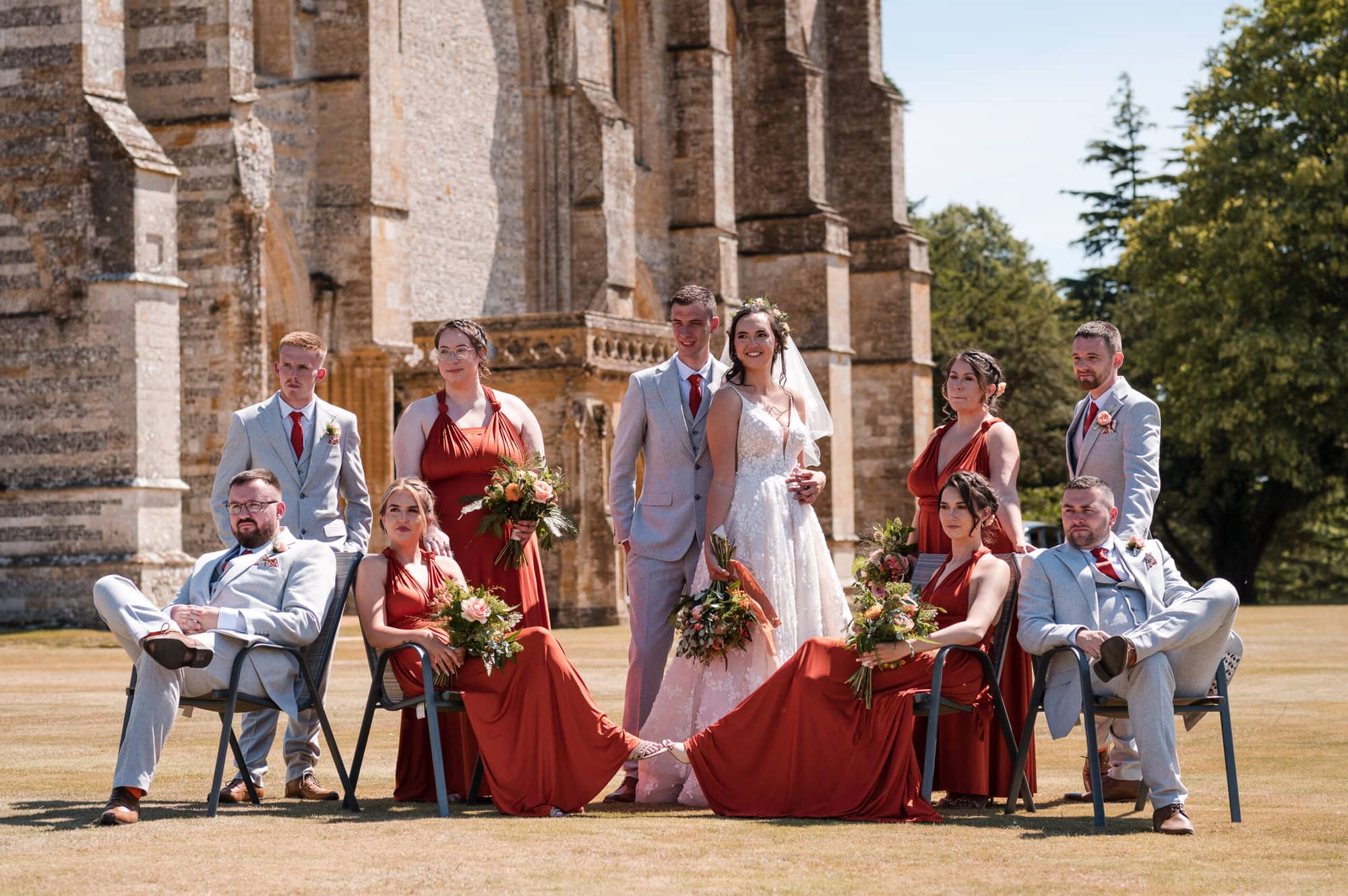 Bridal party on the lawn outside Milton Abbey Church wedding