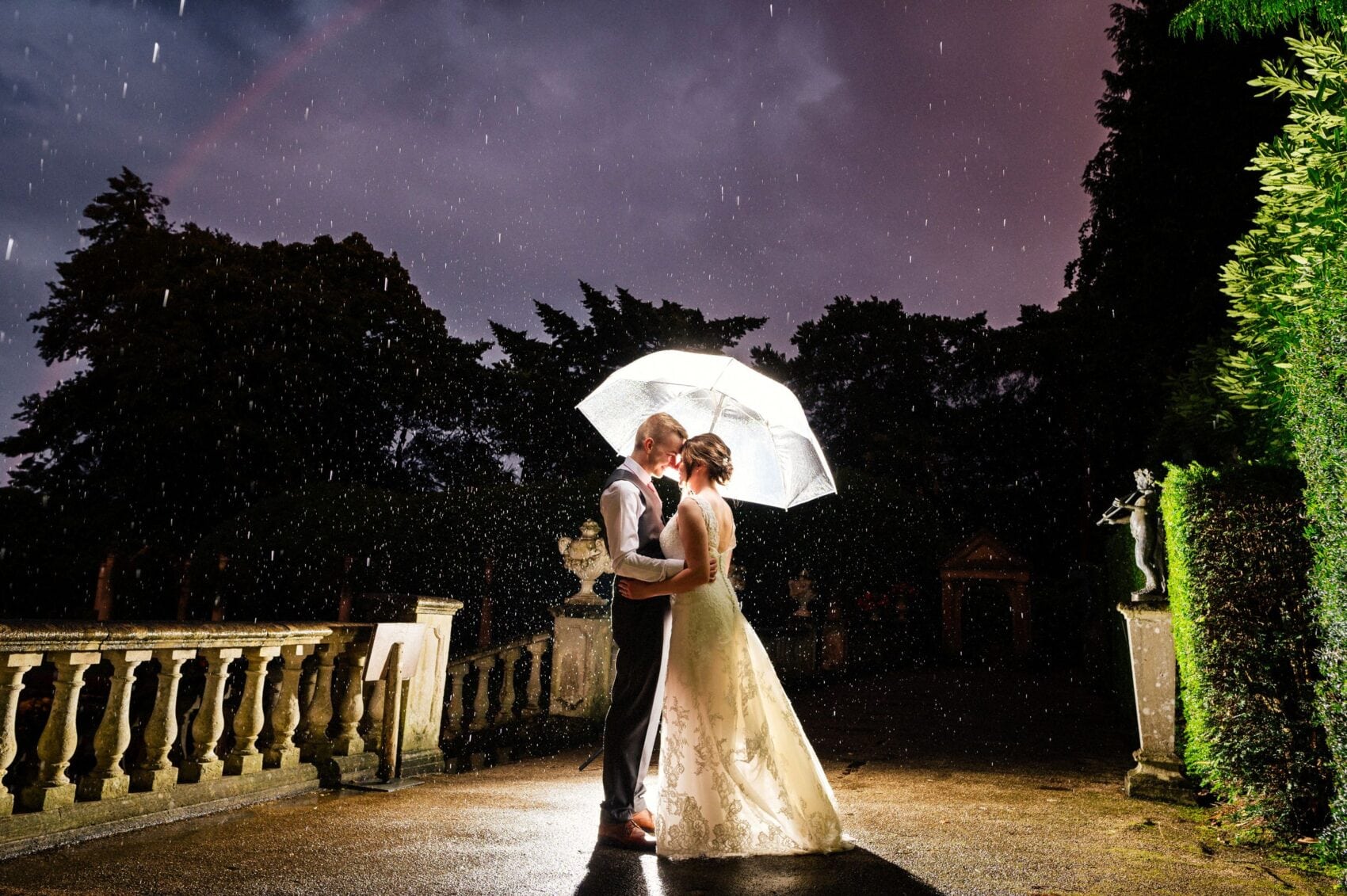 Rainbow and rain with bride and groom at The Italian Villa in Poole