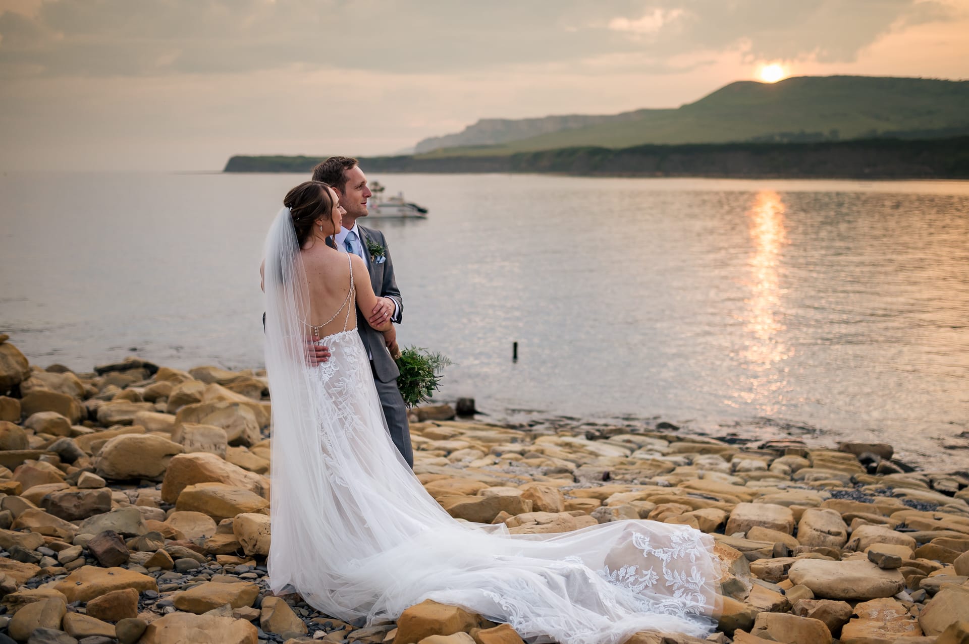 Bride and groom at Kimmeridge sunset aftre Smedmore wedding ceremony