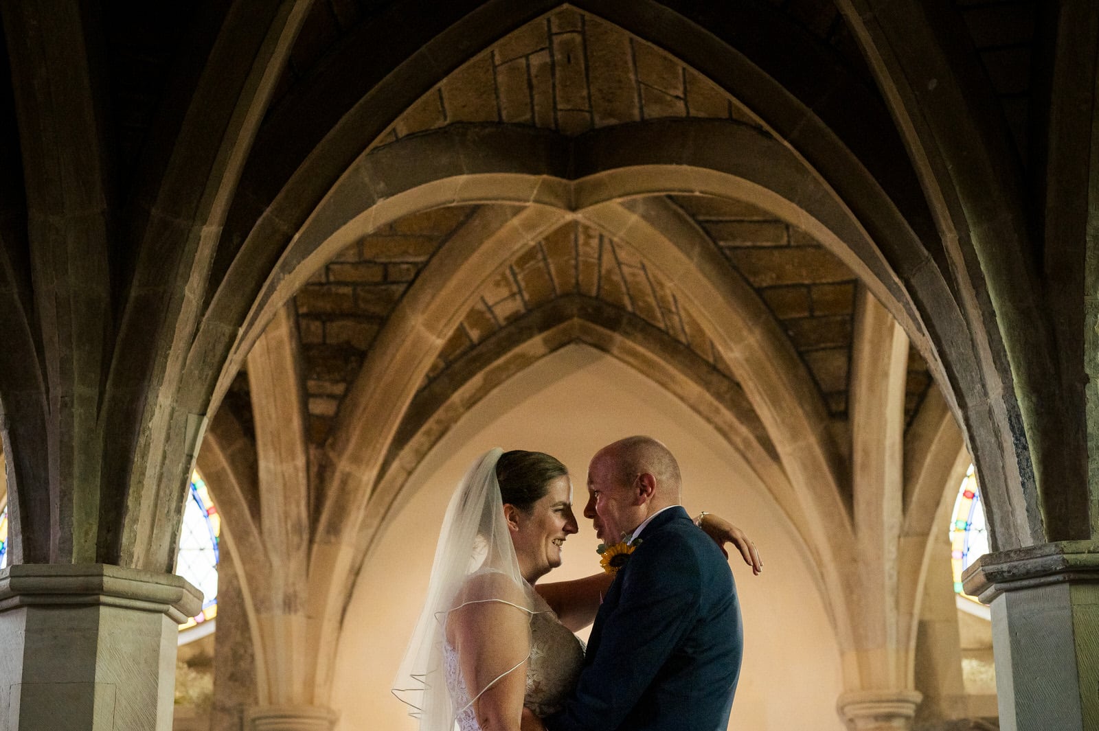 Bride and Groom under the altar in the Wimborne Minster