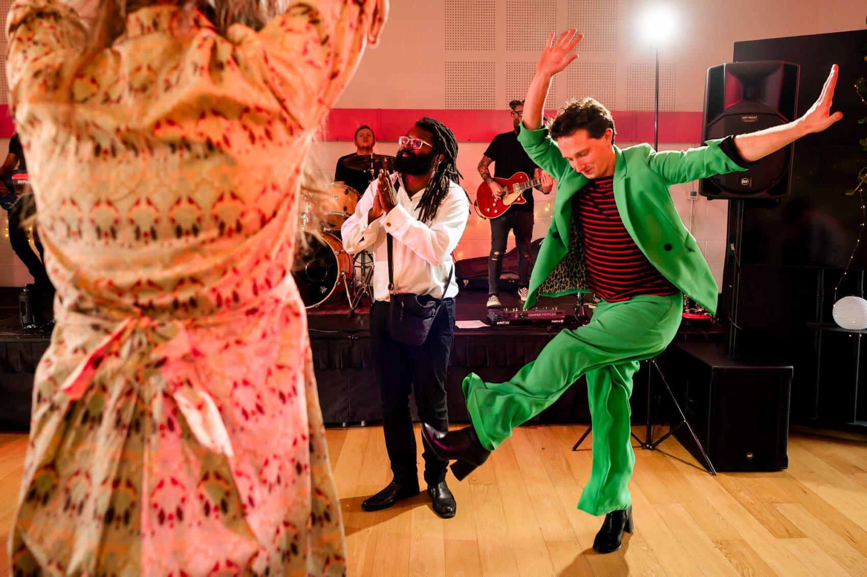 Guy in green suit shows us how to dance