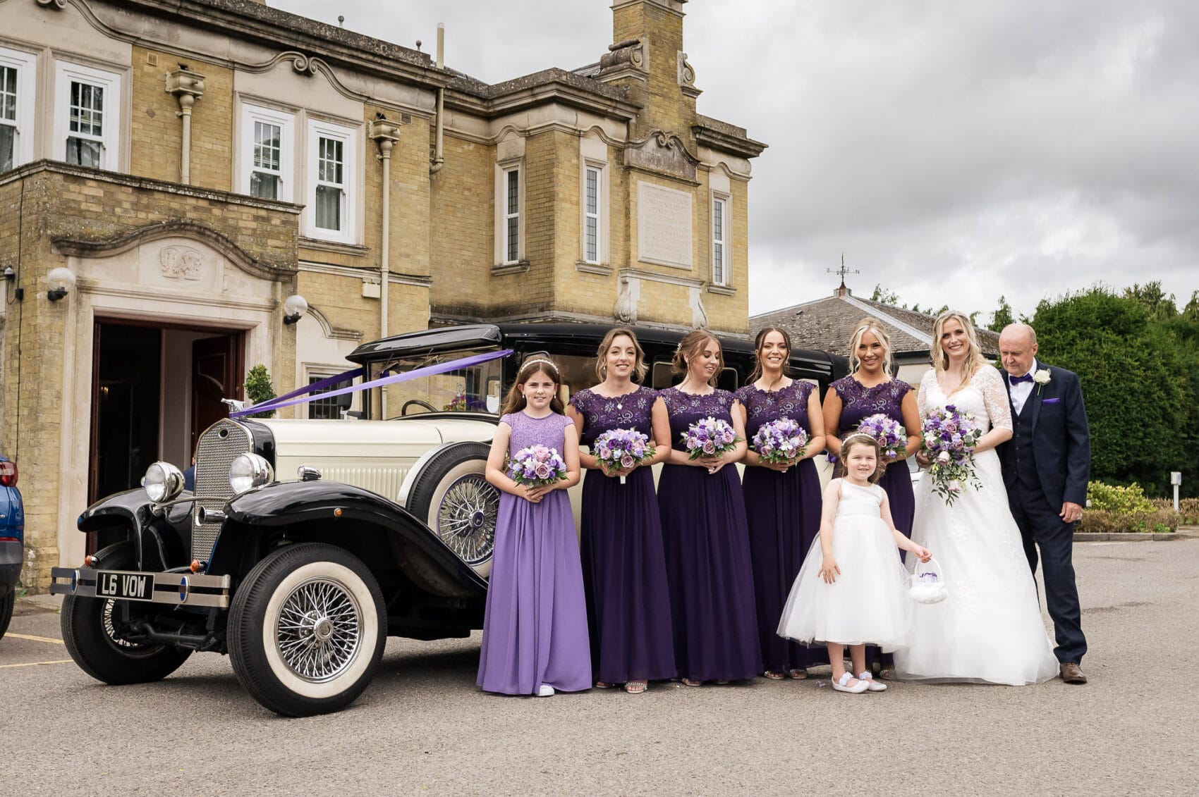 Bride tribe with car outside Chilworth Manor Hotel wedding