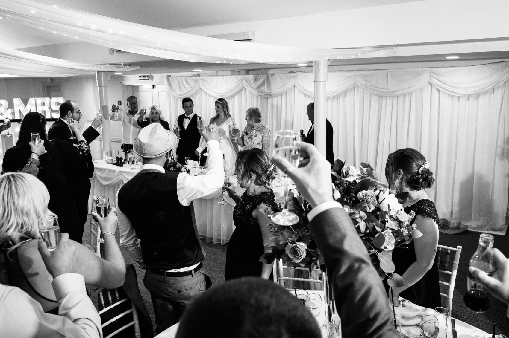 Guests raise a glase to the couple
