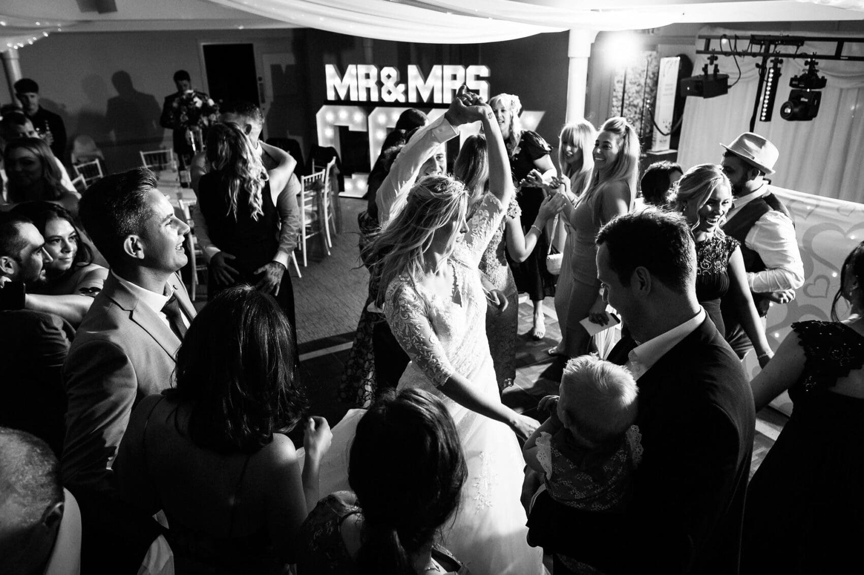Bride and Groom on the dance floor in black and white