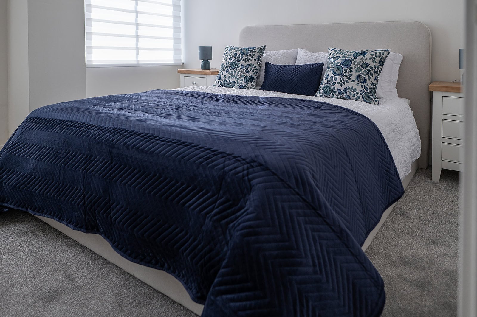 Blue double bed in AirBnb