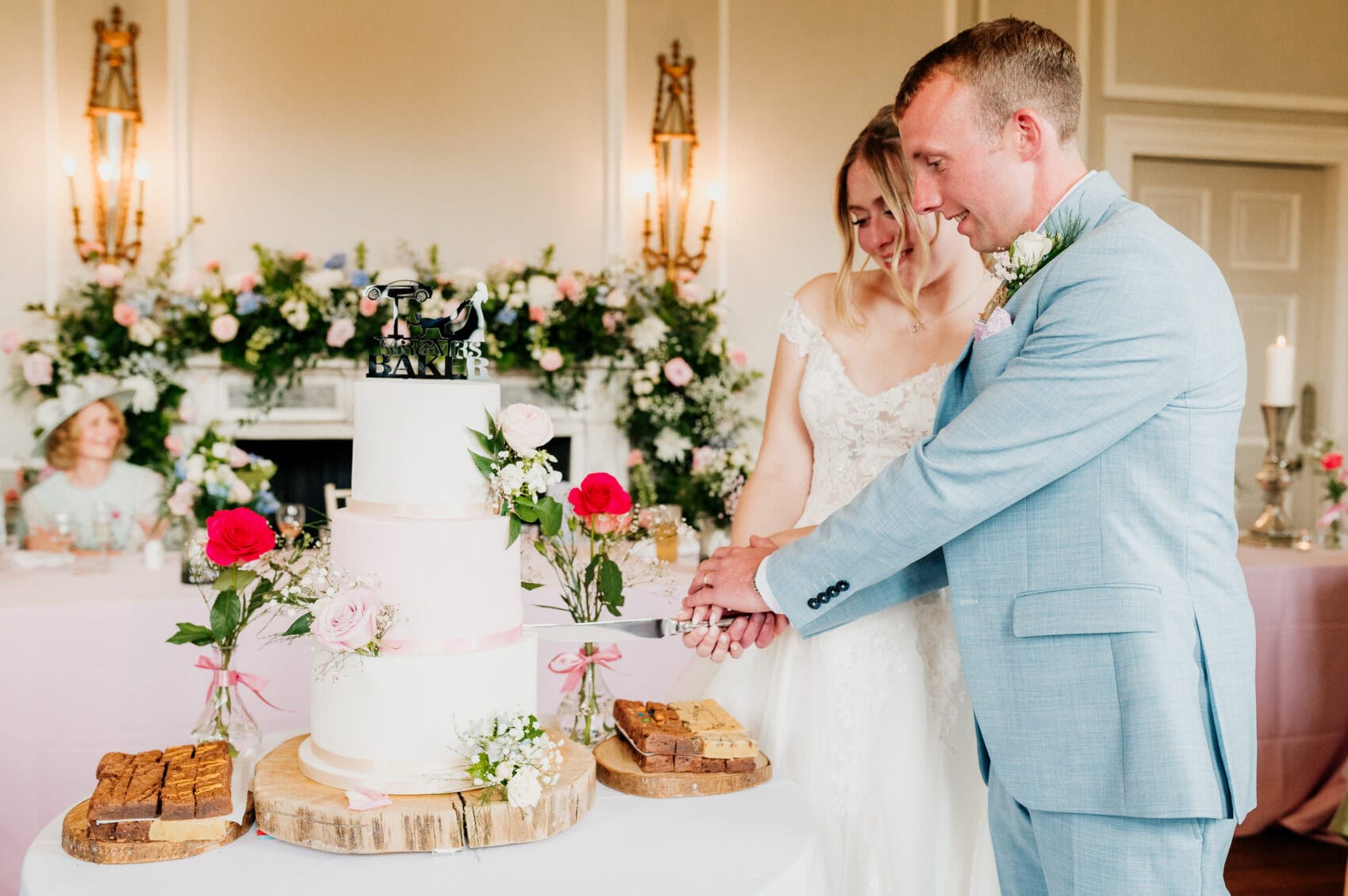 Cutting the cake at Hale Park House Wedding