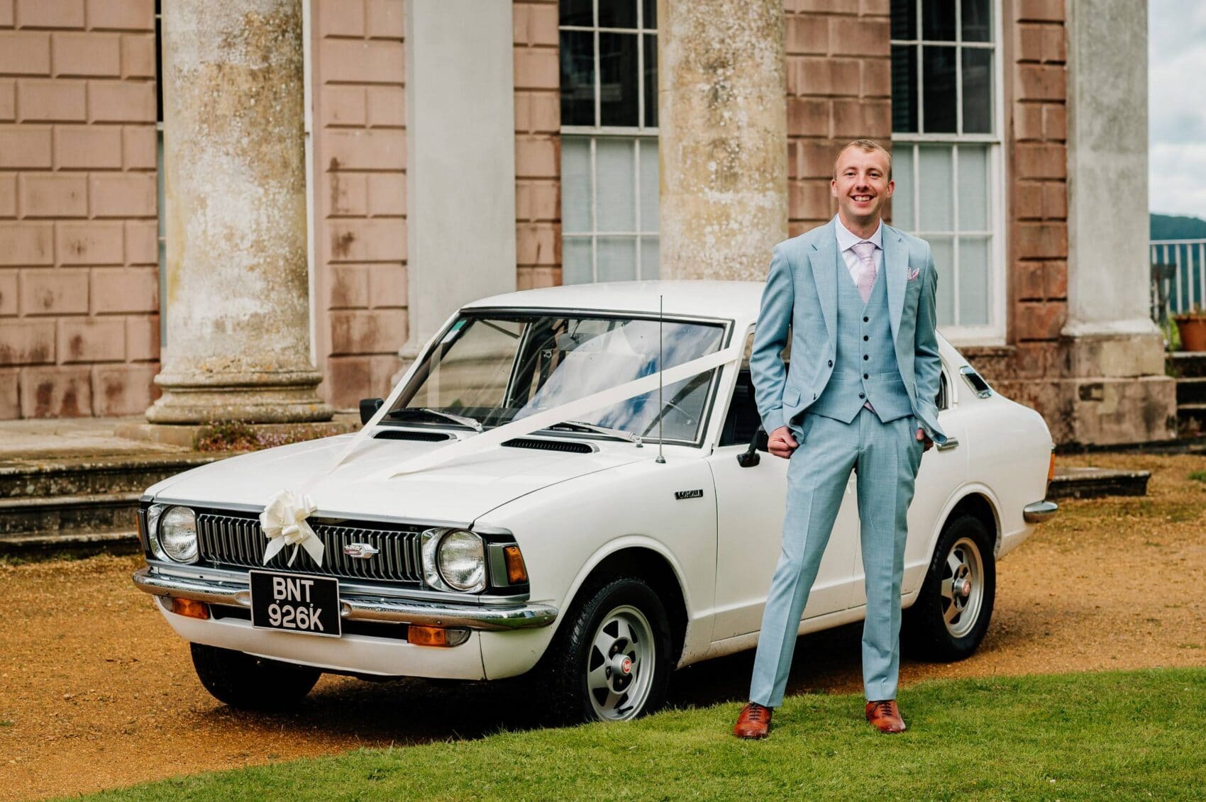 Groom with his Toyota Corolla