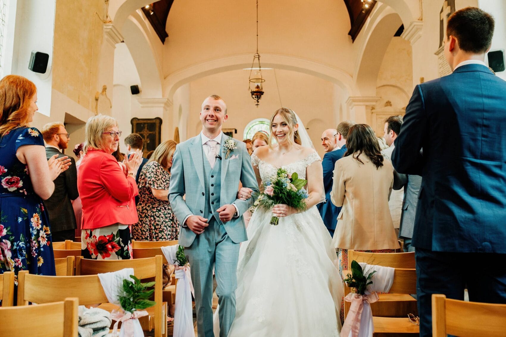 bride and groom walk the aisle at Hale Park House Wedding