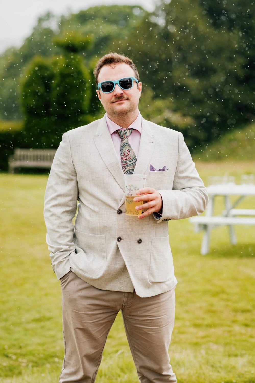 standing in the rain at Hale Park House Wedding