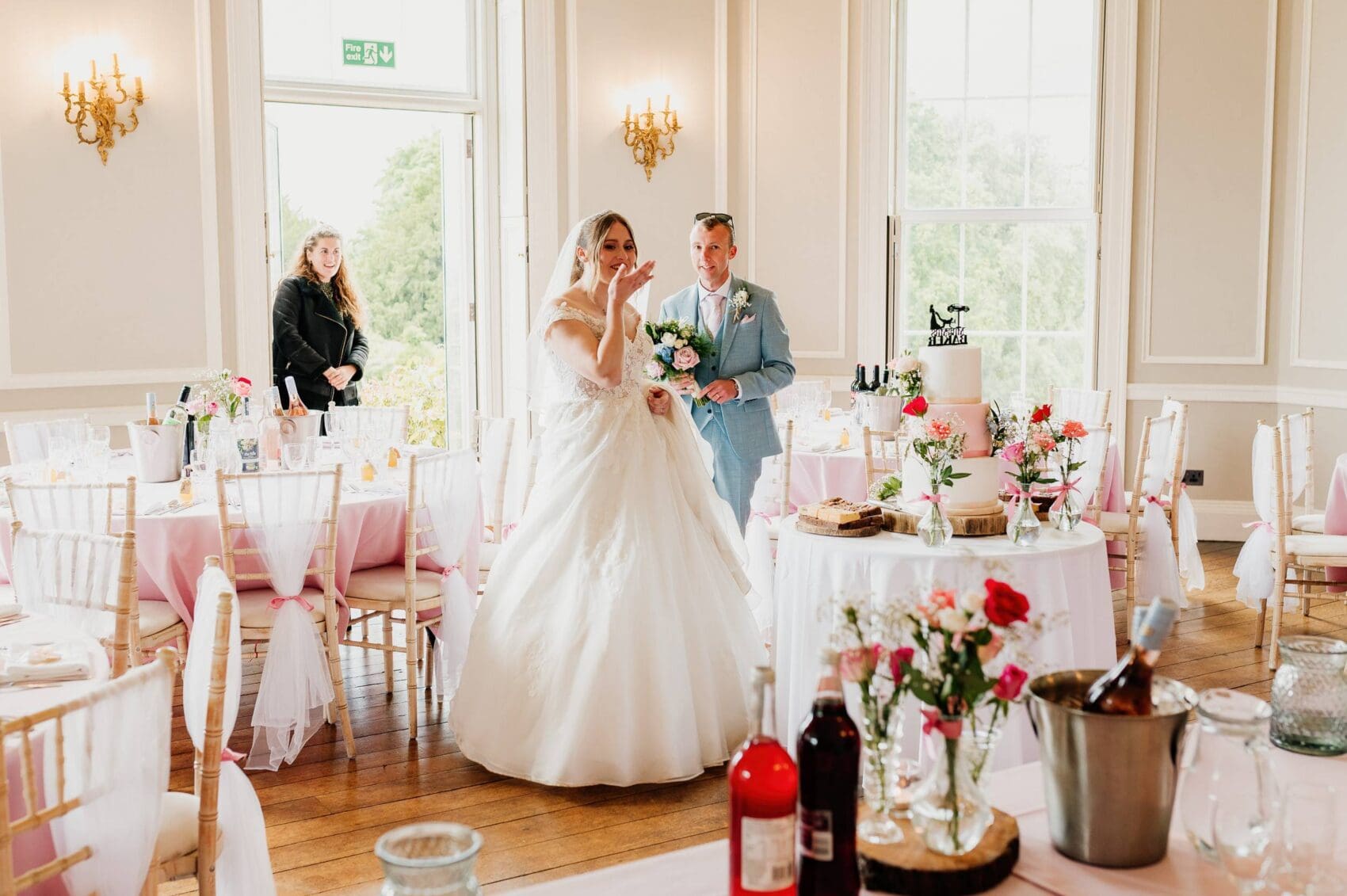 Bride enters the wedding breakfast room at Hale Park House Wedding