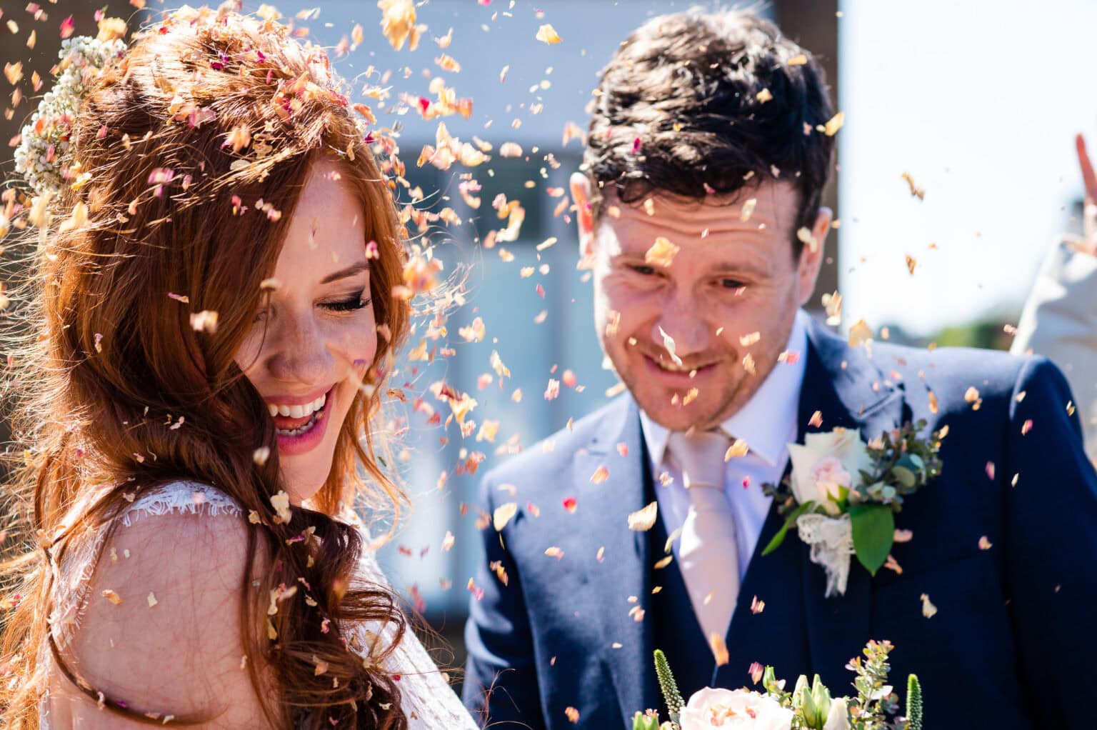 Couple being hit with confetti at Hotel Du Vin, Poole